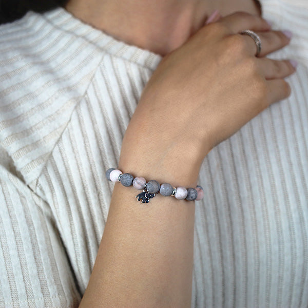 Frosted Pink Jasper Beaded Bracelet with Sterling Silver Elephant Charm Worn by Woman