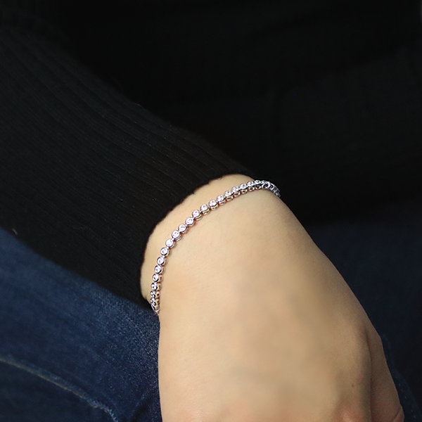 Sterling Silver Tennis Bracelet with Box and Figure-8 Clasp worn by a woman