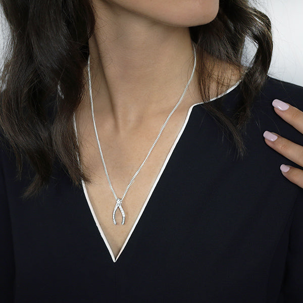 Sterling Silver Wishbone Pendant set with Cubic Zirconia Worn by Woman with Box Chain