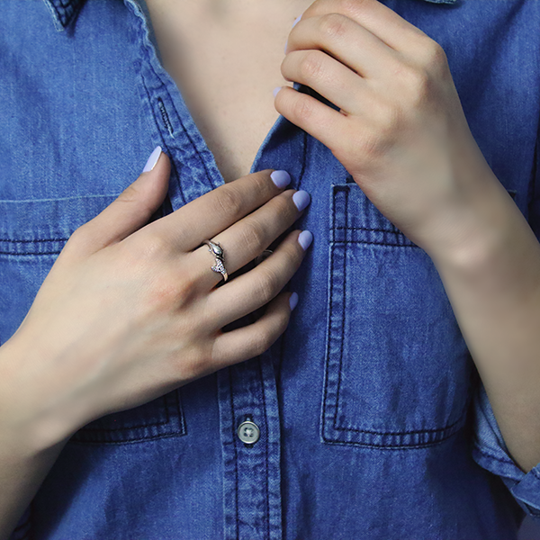 Sterling Silver Dolphin Style Ring set with Cubic Zirconia Worn by Woman