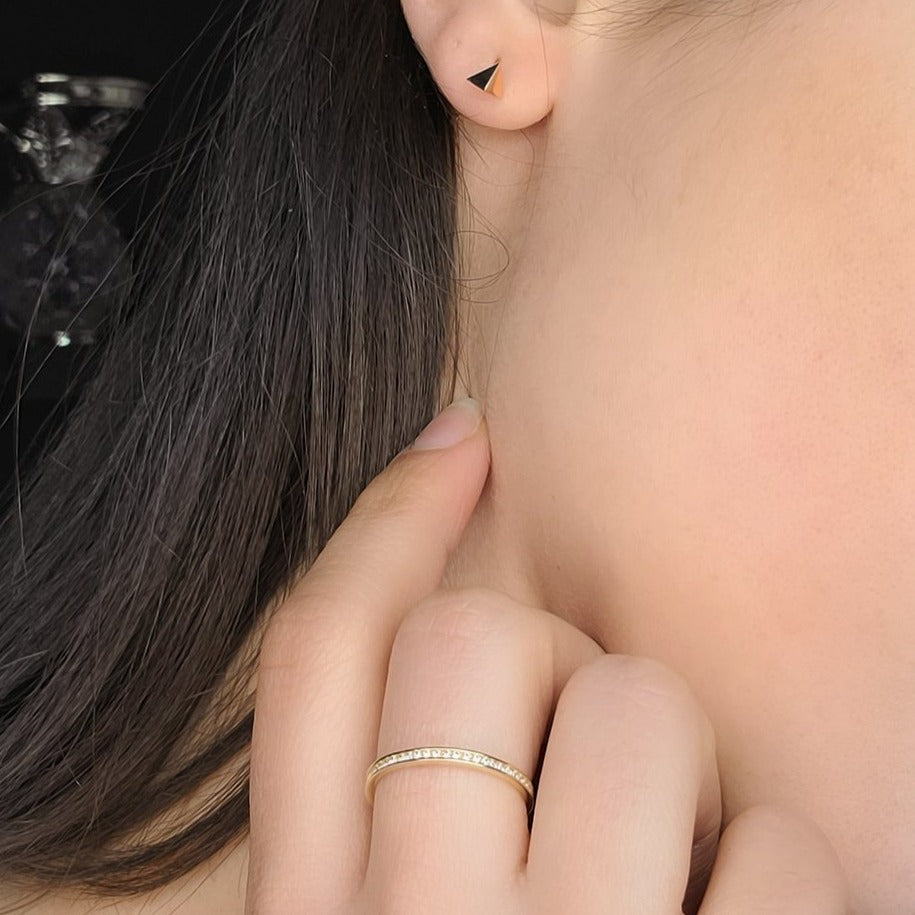 woman wearing prism studs