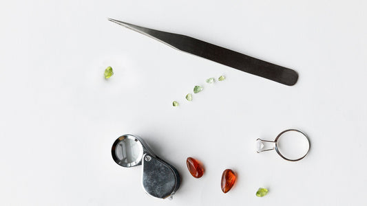 Peridot and other Gemstones with Tweezers and Loupe