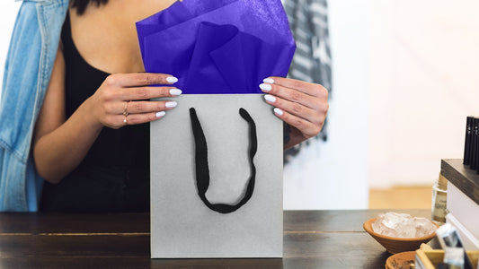 Woman Holding Black Bag with Purple Tissue