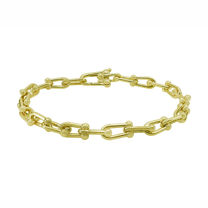A Sterling silver linked bracelet plated in Yellow Gold.