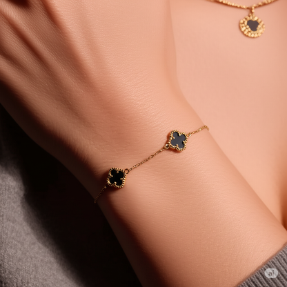 Woman wearing 10kt yellow gold clover bracelet