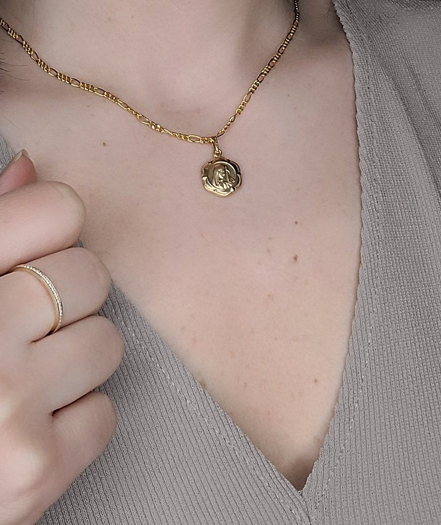 Woman wearing mary medallion