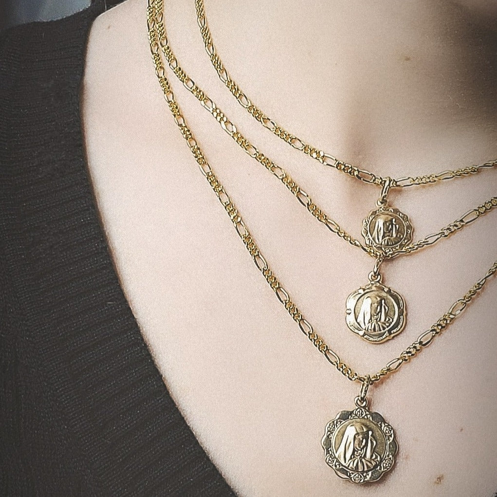 Woman wearing mother mary medallions 2