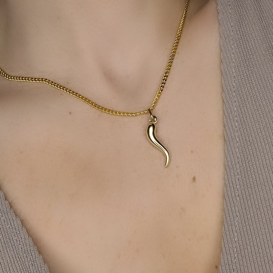 Woman wearing pepper pendant