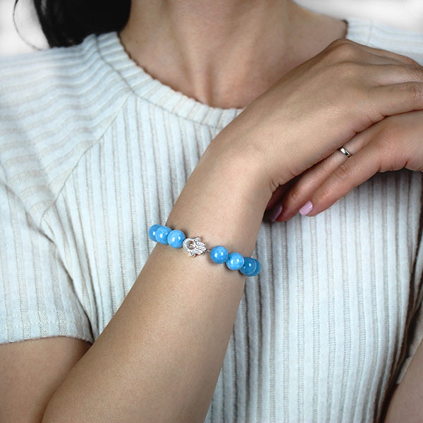 Aquamarine Beaded Bracelet with Sterling Silver Hamsa Charm Worn by Woman