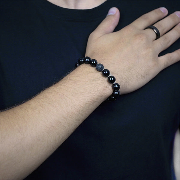 10mm Black Onyx and Black Lava Beaded Bracelet Worn by Man with Tungsten Carbide Ring