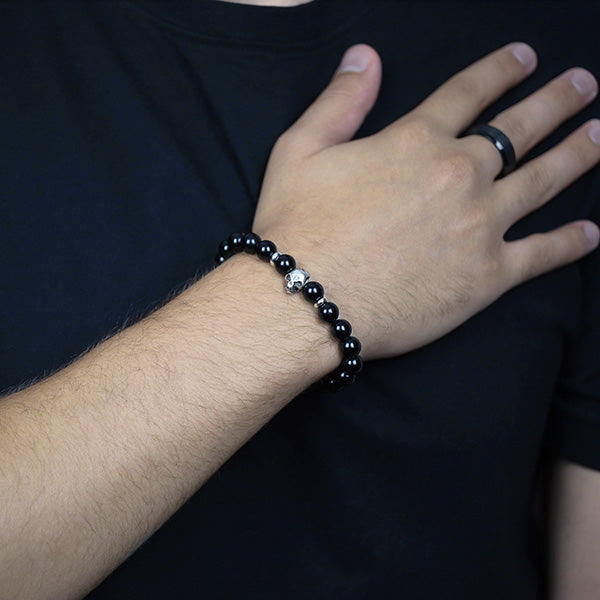 8mm Black Onyx Beaded Bracelet with Sterling Silver Spacer Beads and Skull Worn by Man with Black Tungsten Carbide Ring