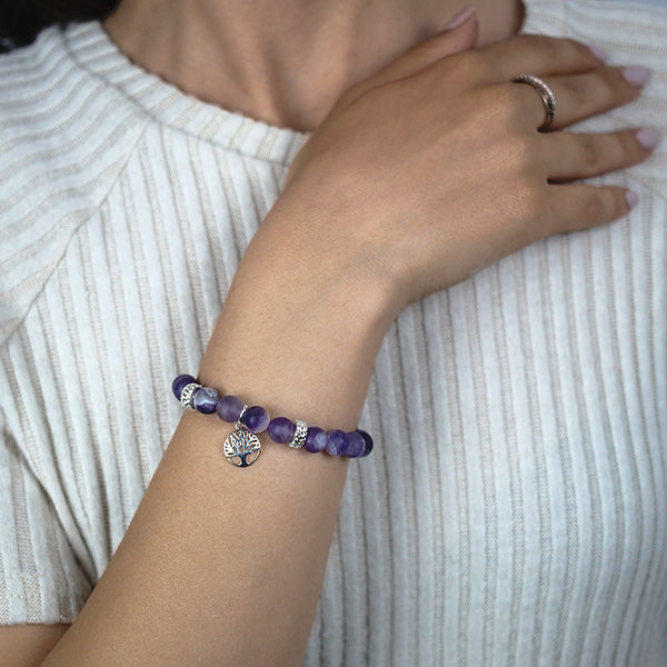 Frosted Amethyst Beaded Bracelet with Sterling Silver Spacer Beads and Tree of Life Charm Worn by Woman