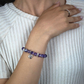 Frosted Amethyst Beaded Bracelet with Sterling Silver Spacer Beads and Tree of Life Charm Worn by Woman