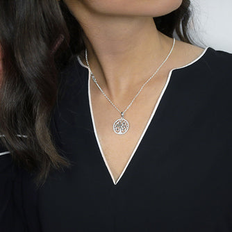 Sterling Silver Tree of Life Pendant set with Cubic Zirconia Worn by Woman