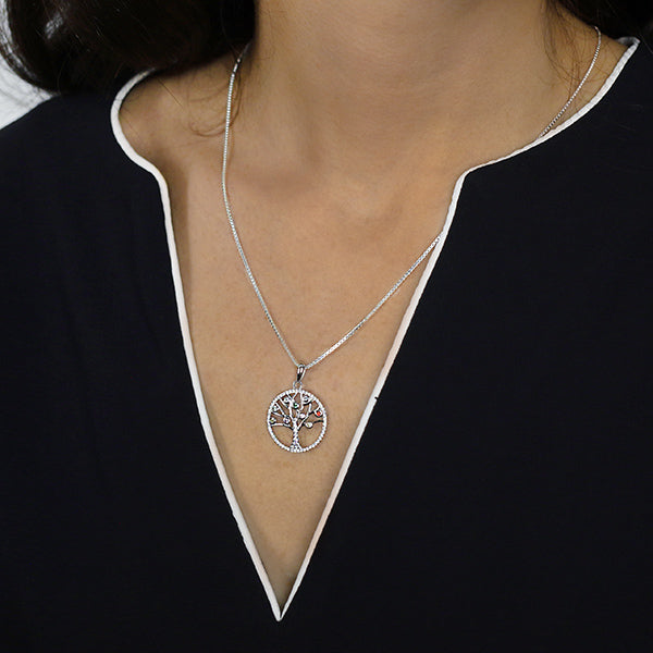 Sterling Silver Tree of Life Pendant set with Cubic Zirconia and Coloured Gemstones Worn by Woman wit Box Chain