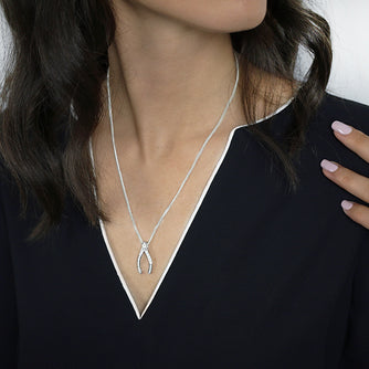 Sterling Silver Wishbone Pendant set with Cubic Zirconia Worn by Woman with Box Chain