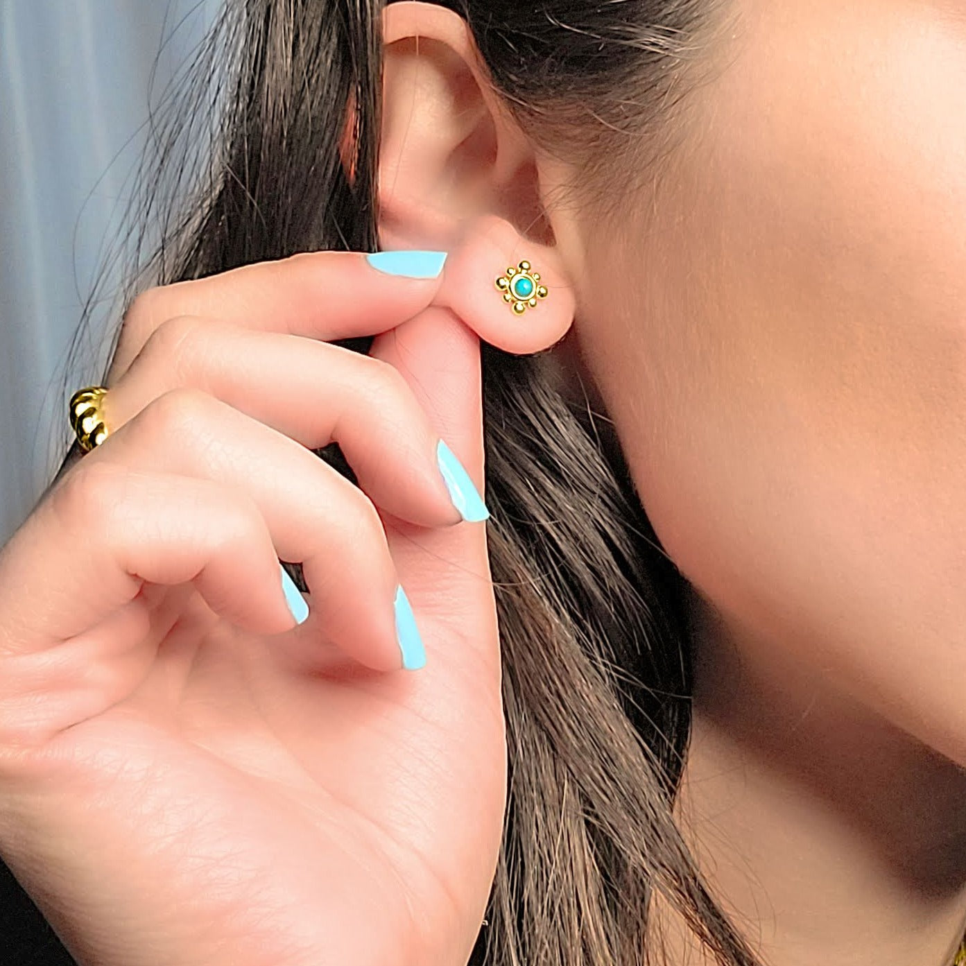 Woman wearing Turquoise studs