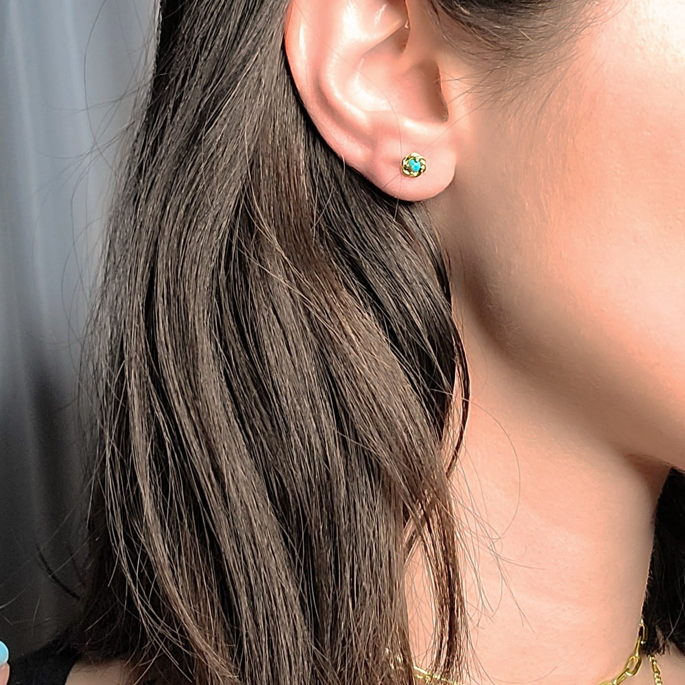Woman wearing Turquoise studs