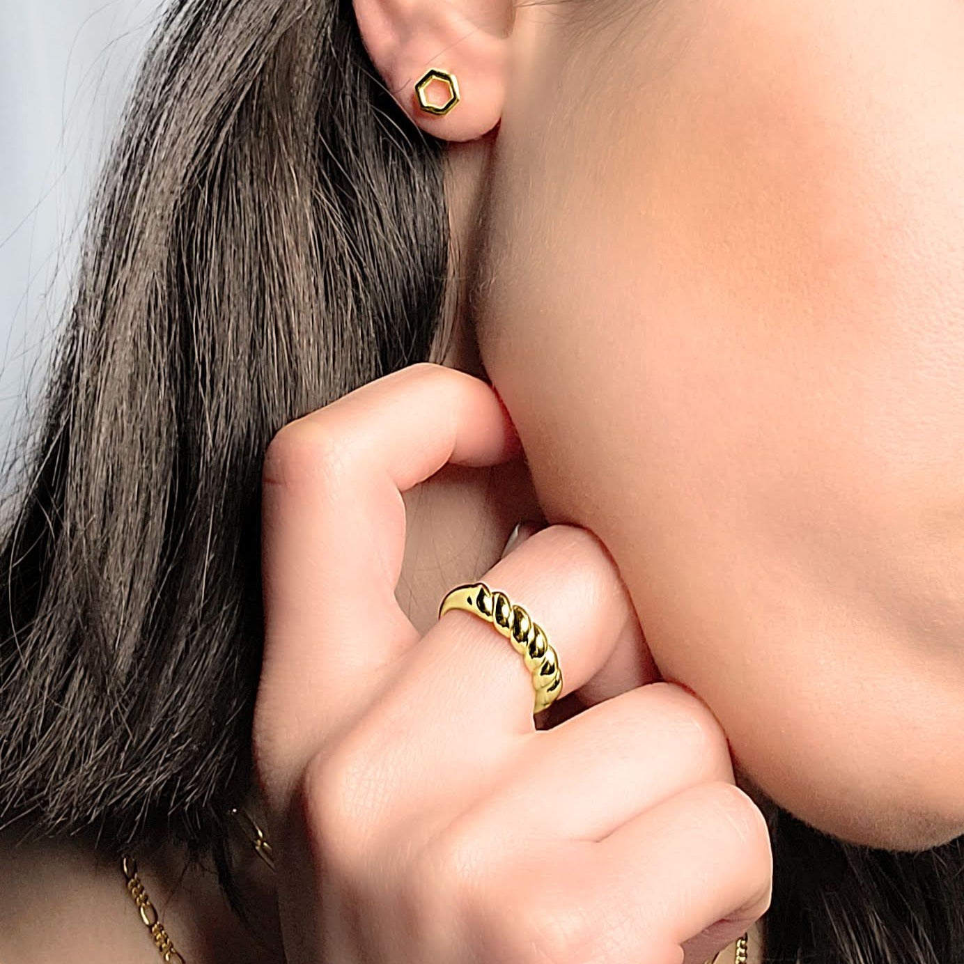 Woman wearing hexagon studs