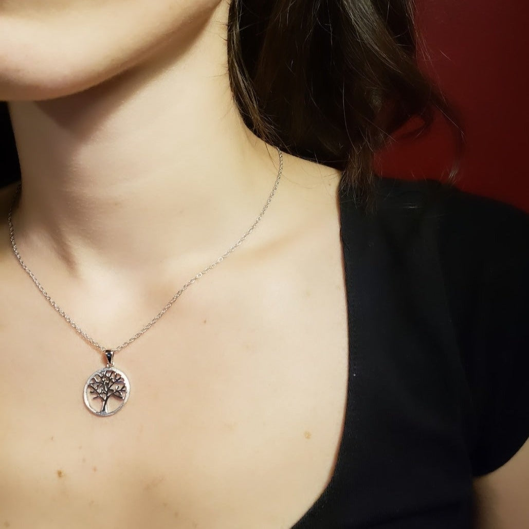 Woman wearing Sterling Silver Tree of life necklace