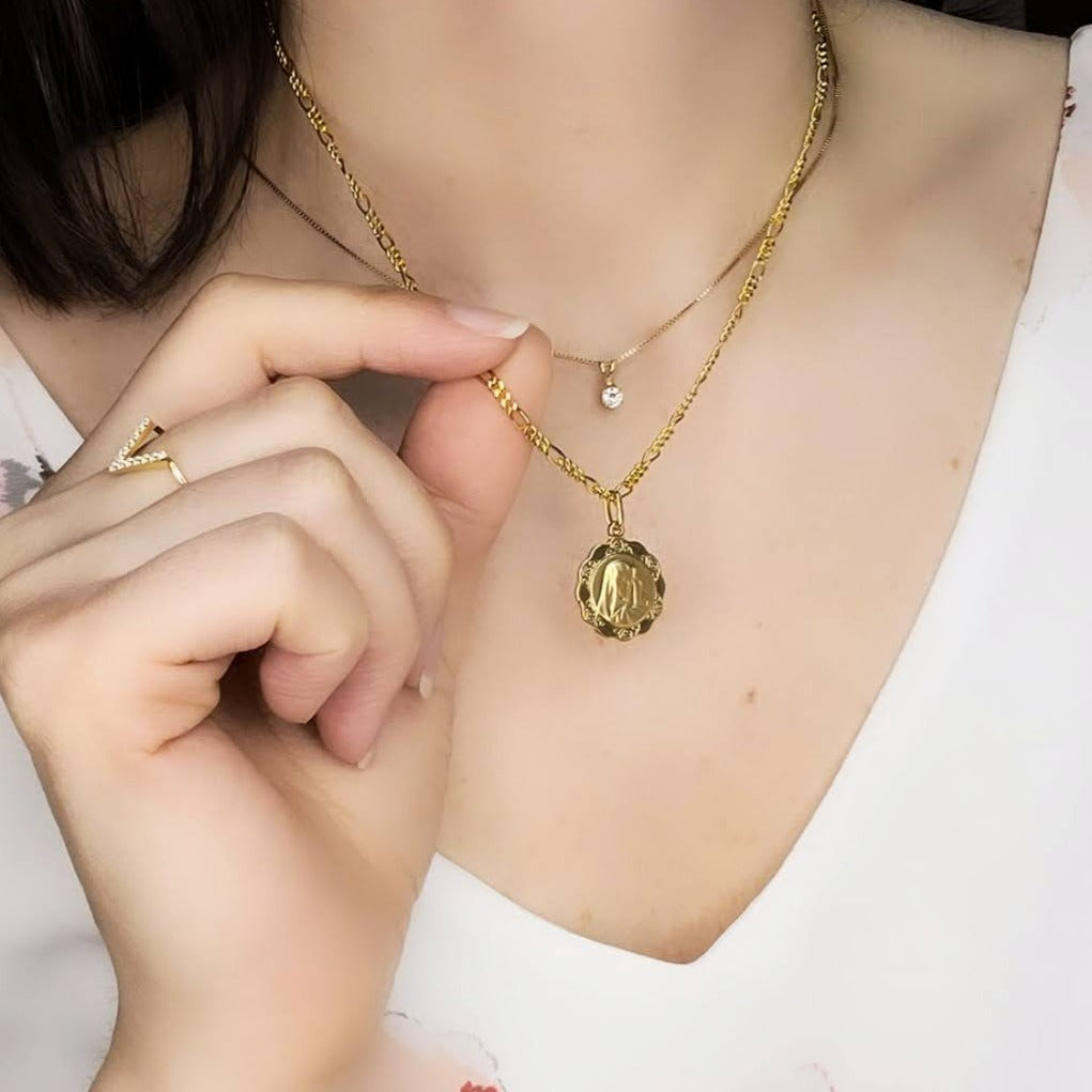 Woman wearing mary medallion 1