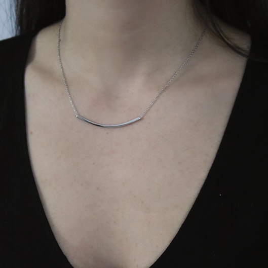 Sterling Silver Bar Pendant through Thin Rolo Style Chain worn by a woman