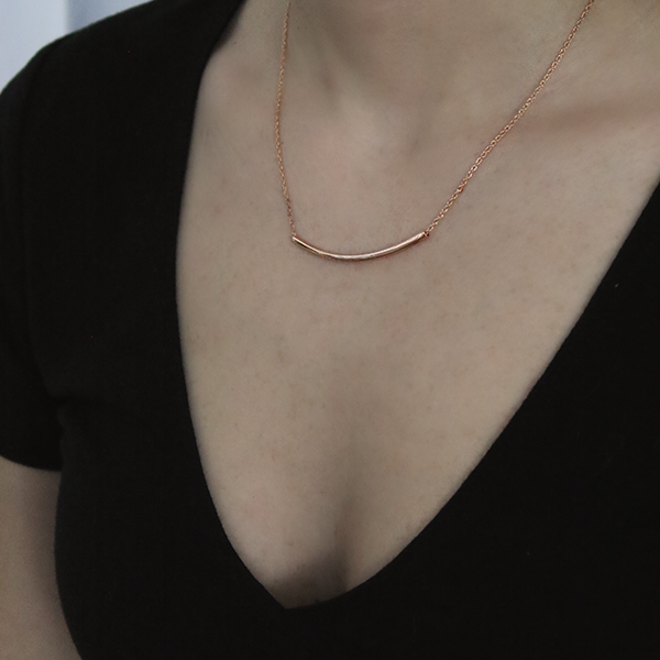 18kt Rose Gold Plated, Sterling Silver Bar Pendant through Thin Rolo Style Chain worn by a woman