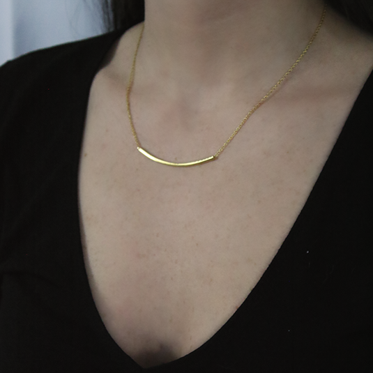 18kt Yellow Gold Plated, Sterling Silver Bar Pendant through Thin Rolo Style Chain worn by a woman