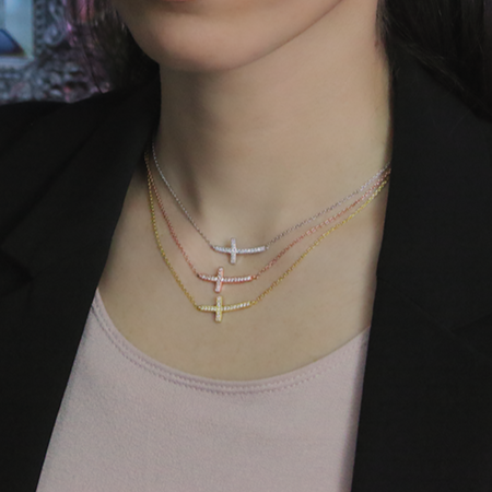 Sterling Silver Cubic Zirconia Horizontal Cross Necklace on Woman's Neck in Rose, Yellow and Silver 1