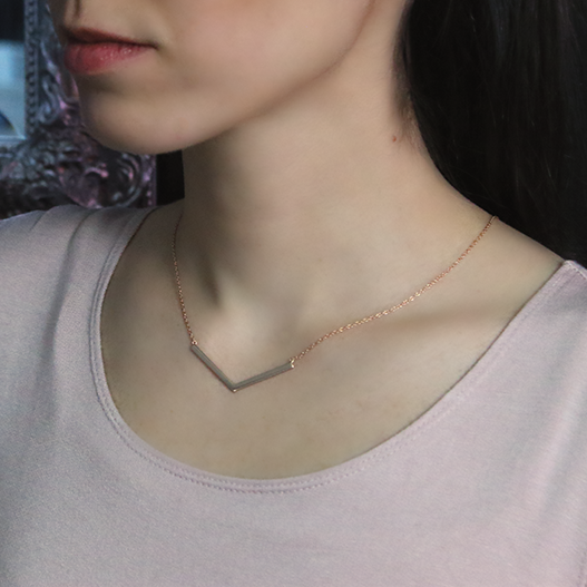 18kt Rose Gold Plated Freedom Necklace Around Woman's Neck