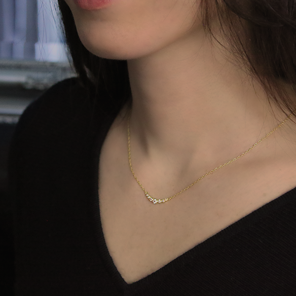 18kt Yellow Gold Plated Winged Necklace set with Cubic Zirconia Around Woman's Neck Sample Photo