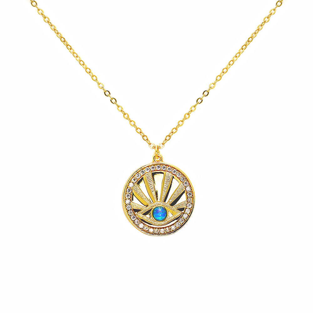 Sterling Silver Evil Eye Medallion plated in 18kt yellow gold set with cubic zirconia and blue opal