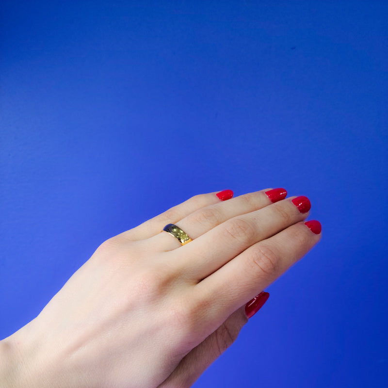 model wearing 4mm yellow gold wedding band