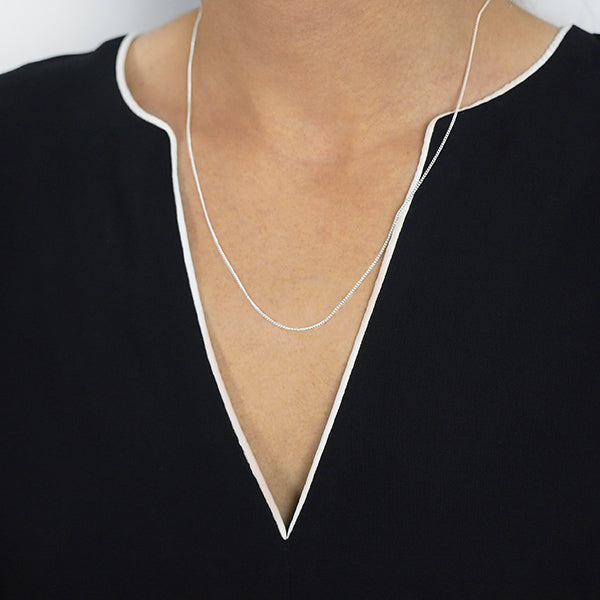 2mm Sterling Silver Curb Style Chain with Spring Ring Worn by Woman