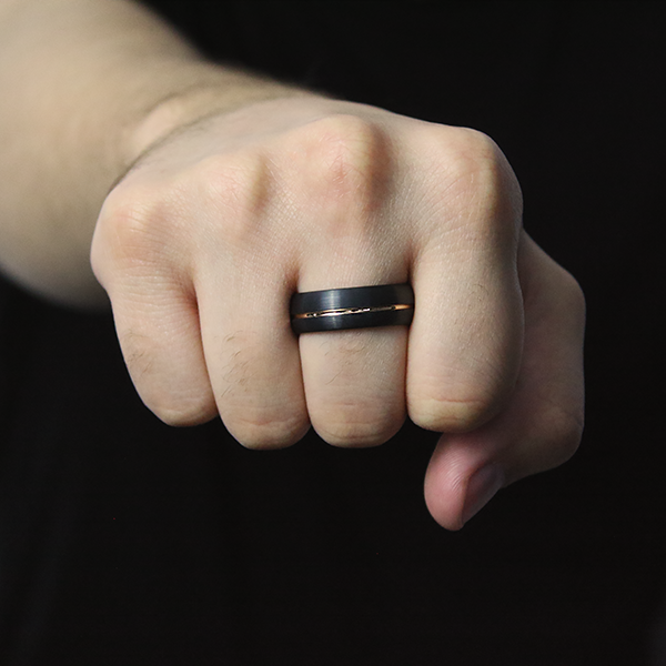 IP Black Plated Satin Finished Tungsten Carbide Ring with a Rose Gold Plated Center Groove worn by a man 2