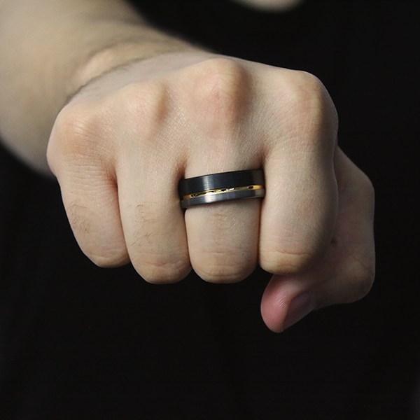 Satin Finished Tungsten Carbide Ring with Black and Yellow Gold Plating worn by a man